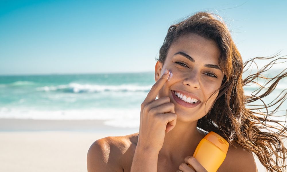 girl aplying sun protection .jpg