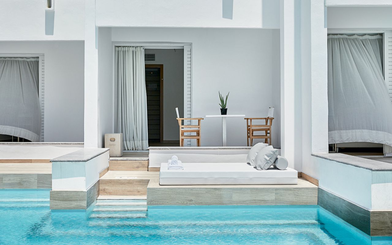 01-at-a-glance-post-swim-up-family-guestroom-grecotel-white-palace