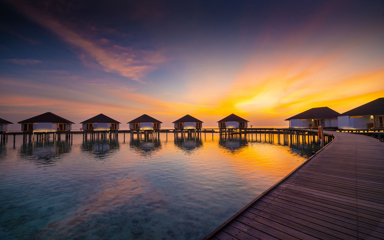 WATER BUNGALOW JETTY AT SUNSET